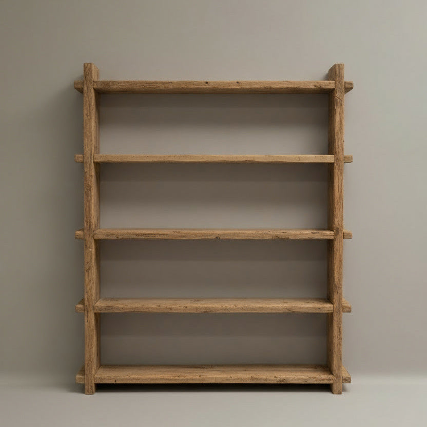 Wooden bookshelf against a plain wall
