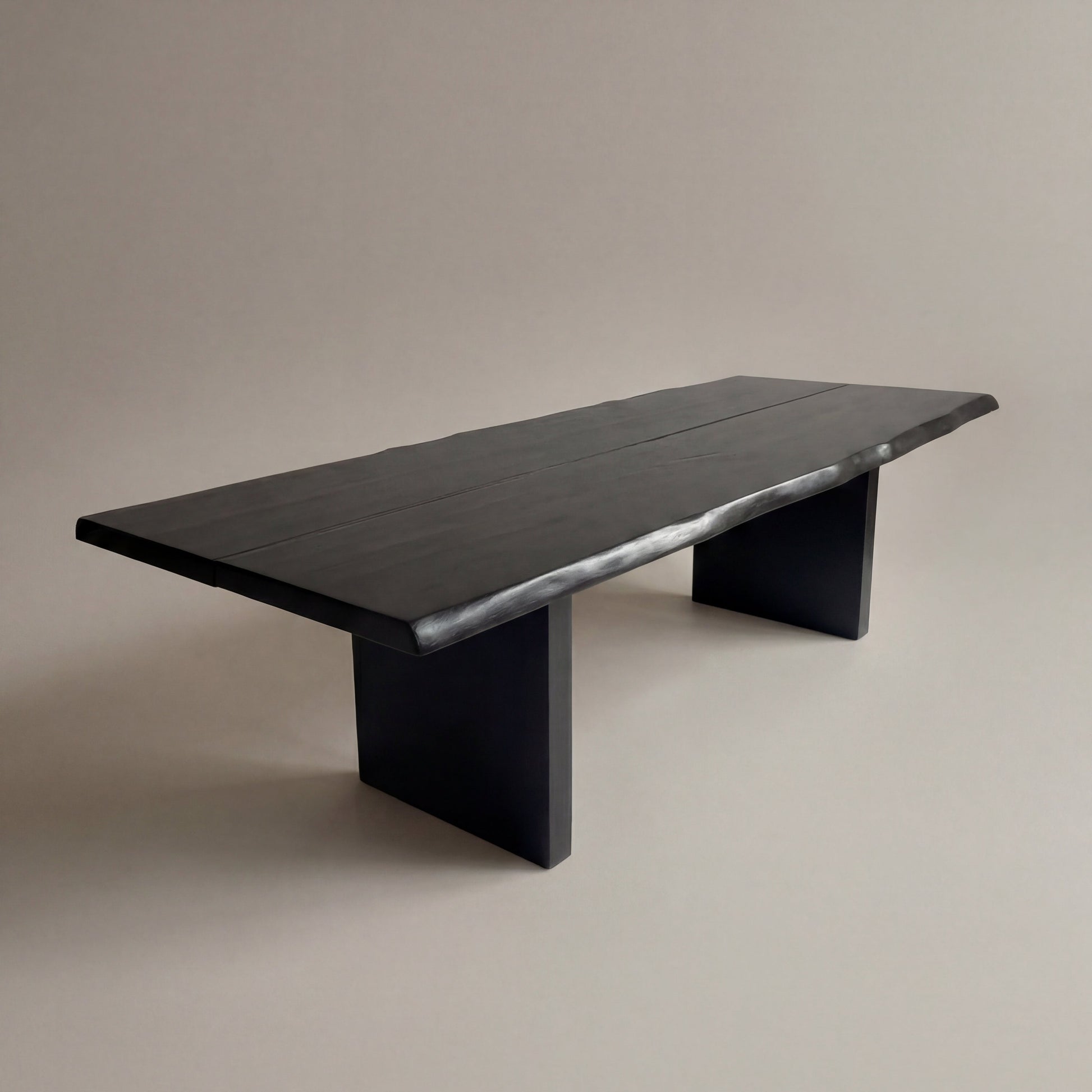 Black wooden bench on a beige background